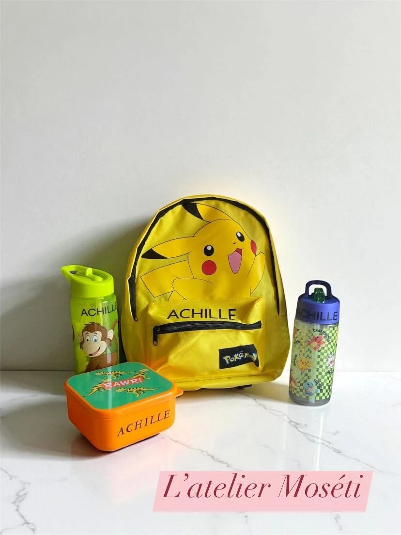 affaires rentrée assortiment sac, gourde et boite à gouter pour la rentrée